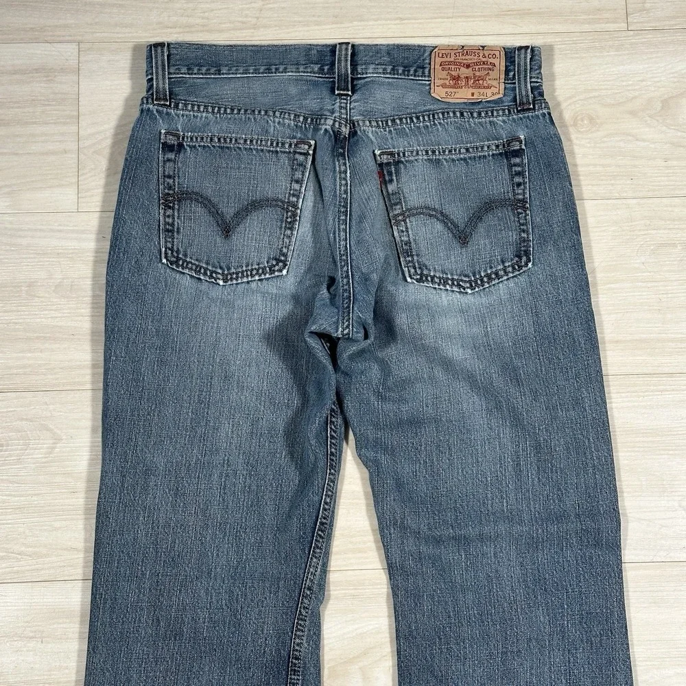 Levi's 527 Slim Bootcut Jeans Mens 34x30 Medium Blue Wash 100% Cotton Distressed